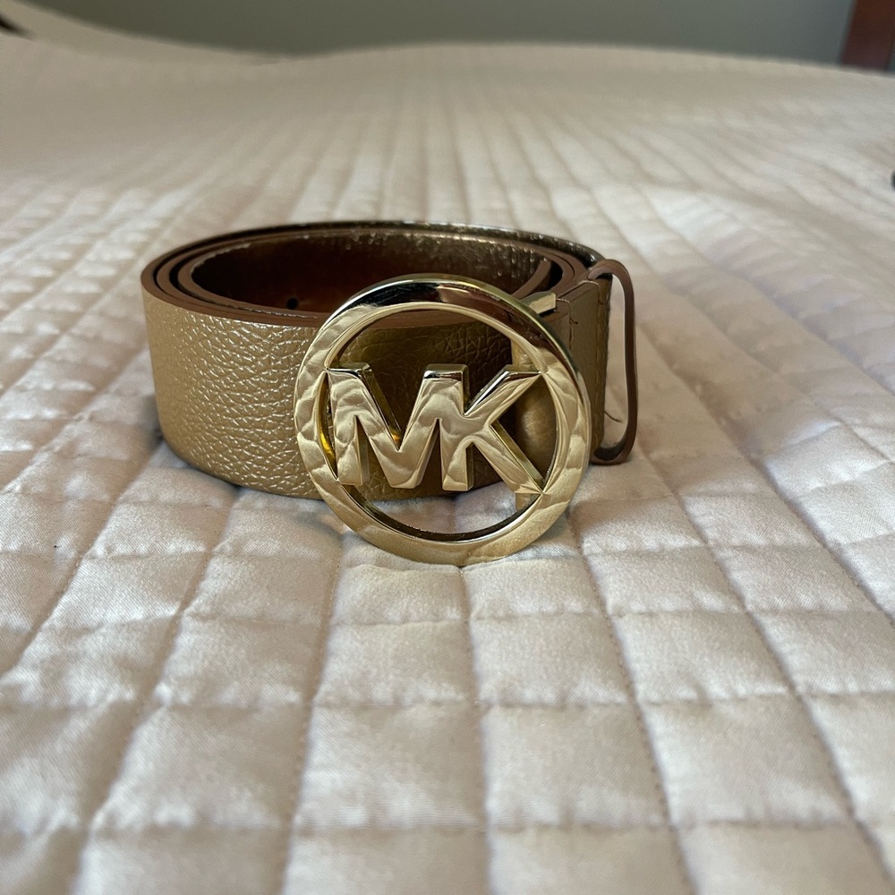 Michael Kors belt size large, beige in color with gold hardware measures 43”
